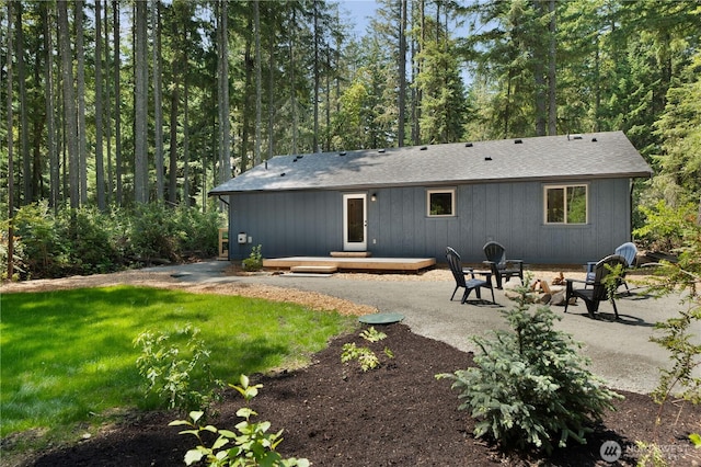 10405 Tahoma Dr, Anderson Island, WA 98303 - rear view of property featuring a patio area, a deck, and a shingled roof