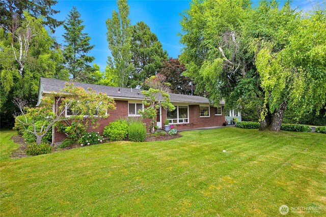2714 Alderwood Ave, Bellingham, WA 98225 - rear view of house featuring a lawn and brick siding