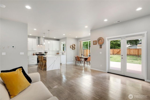 8438 Tacoma Ave S, Tacoma, WA 98444 - living area featuring french doors, recessed lighting, and light wood-style floors