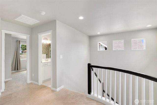 8438 Tacoma Ave S, Tacoma, WA 98444 - corridor with an upstairs landing, light carpet, and recessed lighting