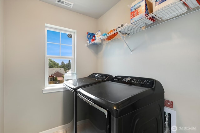 8438 Tacoma Ave S, Tacoma, WA 98444 - washroom with washing machine and dryer and baseboards