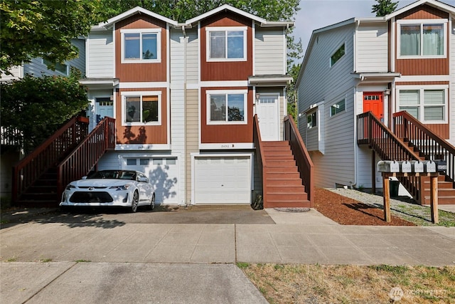 8450 25th Ave SW Unit B, Seattle, WA 98106 - view of front of home with stairs, concrete driveway, and an attached garage