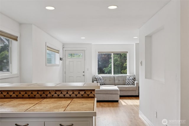 8450 25th Ave SW Unit B, Seattle, WA 98106 - foyer with wood finished floors and recessed lighting