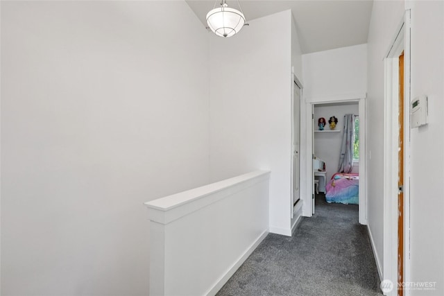 8450 25th Ave SW Unit B, Seattle, WA 98106 - hallway with dark colored carpet and an upstairs landing