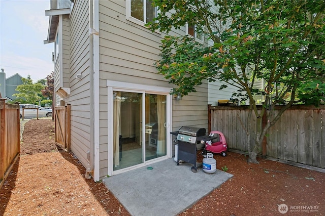 8450 25th Ave SW Unit B, Seattle, WA 98106 - rear view of house featuring a patio area and a fenced backyard
