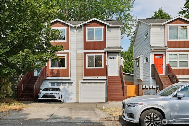 8450 25th Ave SW Unit B, Seattle, WA 98106 - multi unit property with stairway, entry steps, an attached garage, and driveway