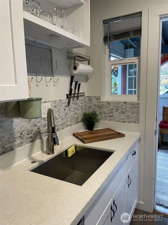 41504 Mountain View Pl E, Gold Bar, WA 98251 - kitchen with white cabinets, decorative backsplash, light stone countertops, and open shelves