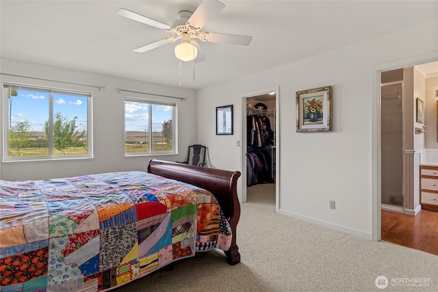 19627 Rd A NE, Soap Lake, WA 98851 - carpeted bedroom featuring a walk in closet, ceiling fan, and a closet
