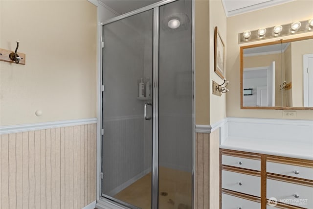 19627 Rd A NE, Soap Lake, WA 98851 - bathroom featuring crown molding, vanity, wainscoting, and a shower stall