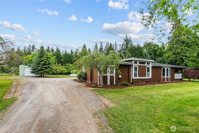 4030 Twin Creek Rd, Ferndale, WA 98248 - mid-century home with dirt driveway, a front lawn, and a detached garage