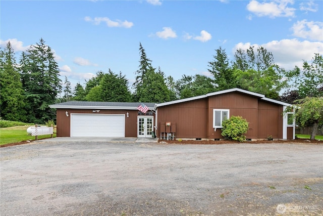 4030 Twin Creek Rd, Ferndale, WA 98248 - view of front facade with french doors, an attached garage, and driveway
