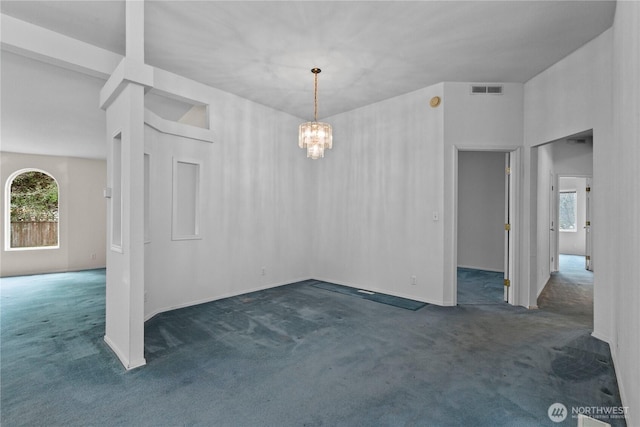 4030 Twin Creek Rd, Ferndale, WA 98248 - unfurnished dining area with carpet flooring, healthy amount of natural light, and a chandelier