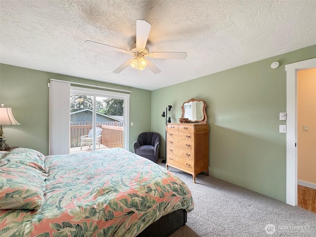1521 W 13th St, Port Angeles, WA 98363 - bedroom with access to exterior, carpet, ceiling fan, and a textured ceiling