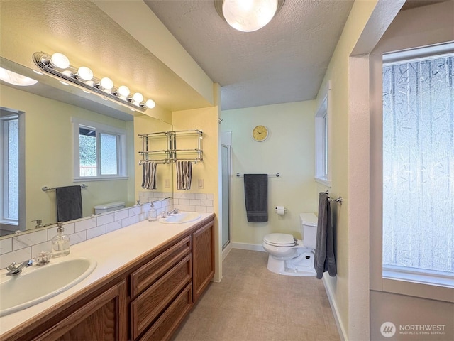 1521 W 13th St, Port Angeles, WA 98363 - full bath featuring a shower stall, double vanity, and a textured ceiling