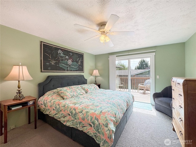 1521 W 13th St, Port Angeles, WA 98363 - carpeted bedroom featuring access to exterior, a textured ceiling, and ceiling fan