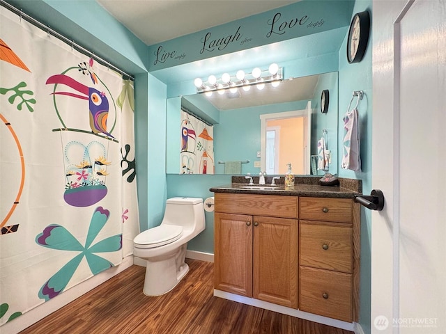 1521 W 13th St, Port Angeles, WA 98363 - bathroom with wood finished floors, vanity, and a shower with shower curtain