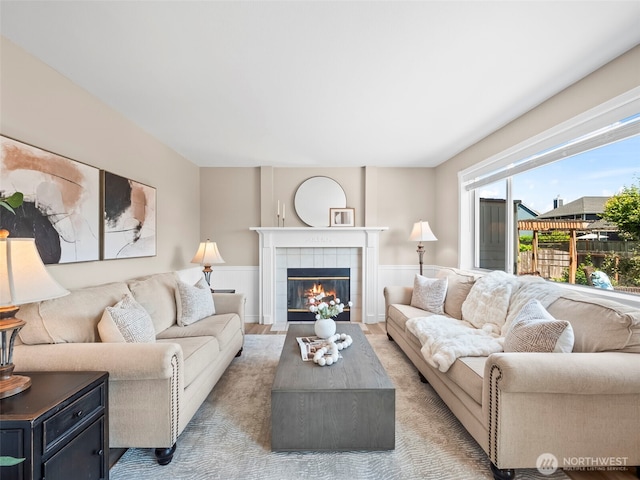 535 Blanchat Ct, Enumclaw, WA 98022 - living room featuring a fireplace and wainscoting