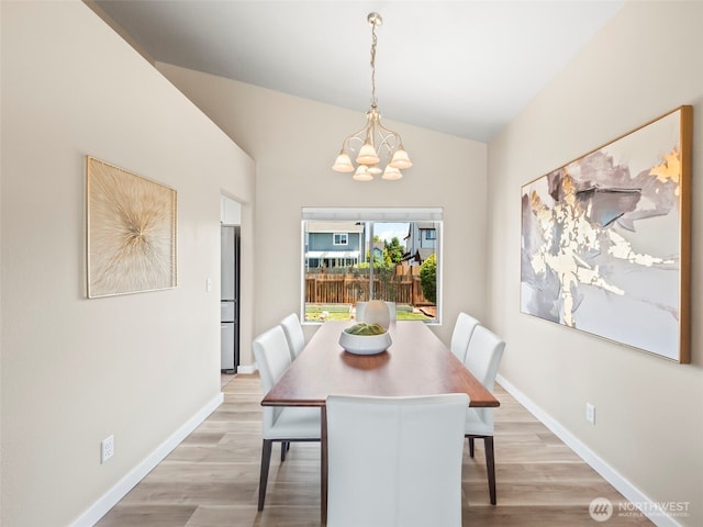 535 Blanchat Ct, Enumclaw, WA 98022 - dining space with light wood-type flooring, a chandelier, and lofted ceiling