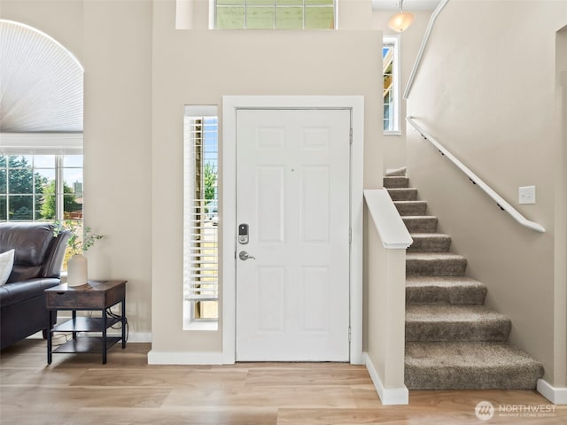 535 Blanchat Ct, Enumclaw, WA 98022 - foyer featuring wood finished floors, stairway, and healthy amount of natural light