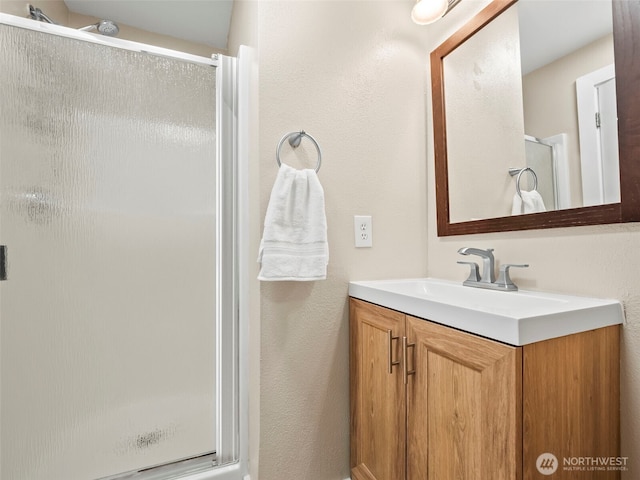 535 Blanchat Ct, Enumclaw, WA 98022 - full bath with vanity, a stall shower, and a textured wall