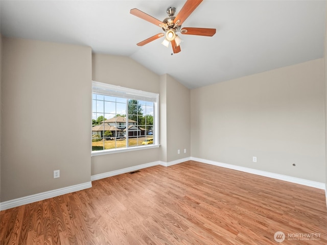535 Blanchat Ct, Enumclaw, WA 98022 - empty room featuring light wood-style floors, a ceiling fan, and vaulted ceiling