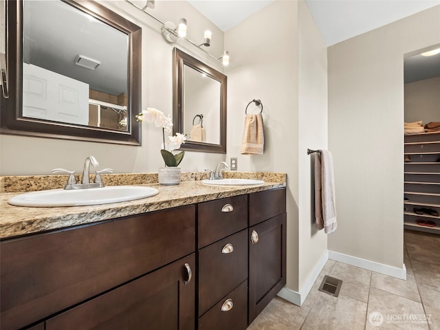 535 Blanchat Ct, Enumclaw, WA 98022 - full bath featuring double vanity, tile patterned flooring, and a spacious closet