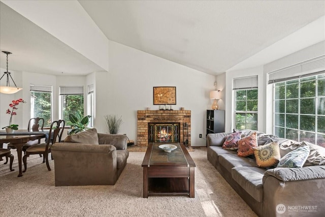 13319 15th Avenue Ct E, Tacoma, WA 98445 - living area featuring plenty of natural light, carpet flooring, vaulted ceiling, and a fireplace