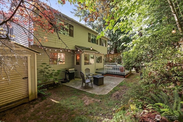 13319 15th Avenue Ct E, Tacoma, WA 98445 - rear view of property with a patio