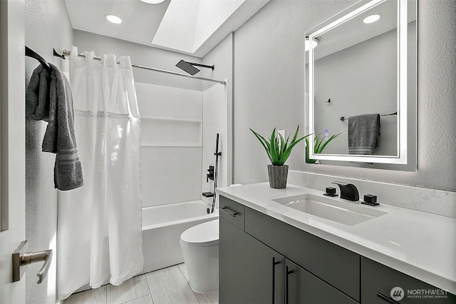 22526 251st Ave SE, Maple Valley, WA 98038 - bathroom featuring vanity, shower / bath combo, a textured wall, and a skylight