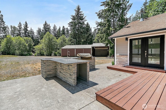 22526 251st Ave SE, Maple Valley, WA 98038 - view of patio featuring a bar, french doors, an outdoor kitchen, and a deck
