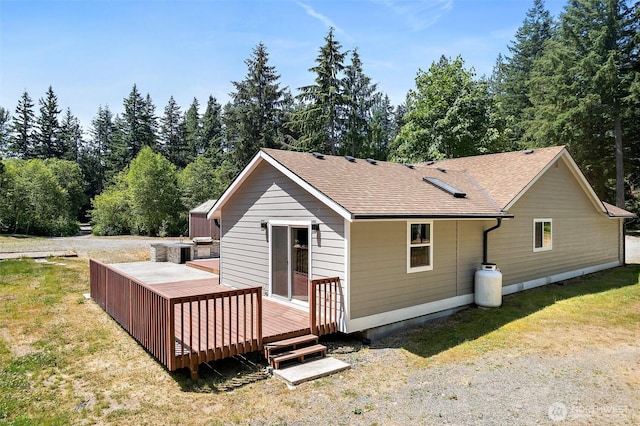 22526 251st Ave SE, Maple Valley, WA 98038 - back of property featuring a deck, a shingled roof, and a lawn