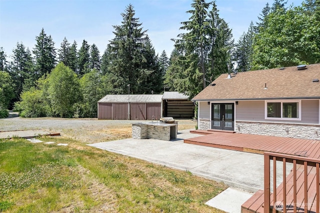 22526 251st Ave SE, Maple Valley, WA 98038 - view of yard featuring french doors, a wooden deck, a patio, and an outdoor structure
