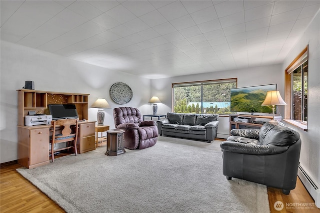 40515 228th Way SE, Enumclaw, WA 98022 - living room with a baseboard heating unit and wood finished floors