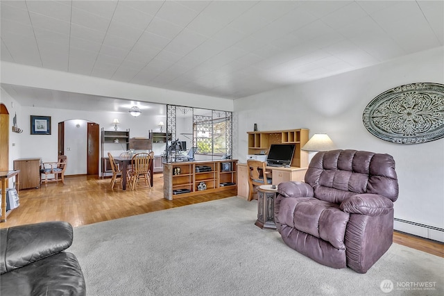 40515 228th Way SE, Enumclaw, WA 98022 - living room featuring arched walkways and wood finished floors