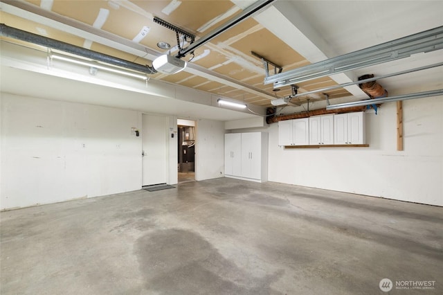 101 NW 58th St Unit 10, Seattle, WA 98107 - garage featuring a garage door opener