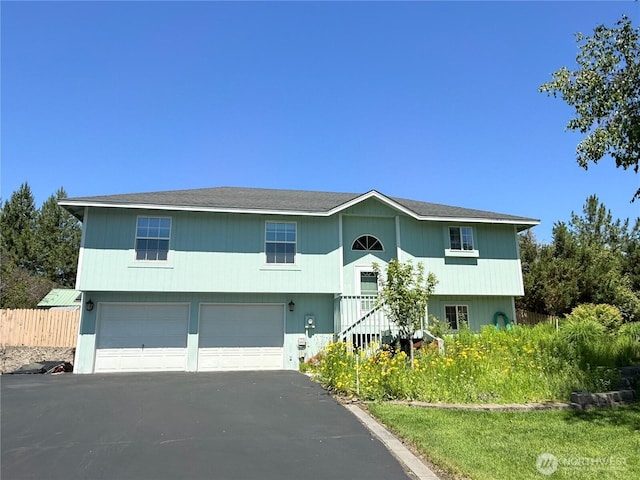 16 River Overlook St, Omak, WA 98841 - bi-level home featuring an attached garage and driveway