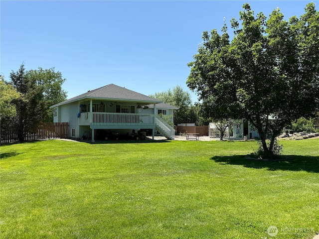 16 River Overlook St, Omak, WA 98841 - rear view of house featuring stairway, a patio area, and a wooden deck