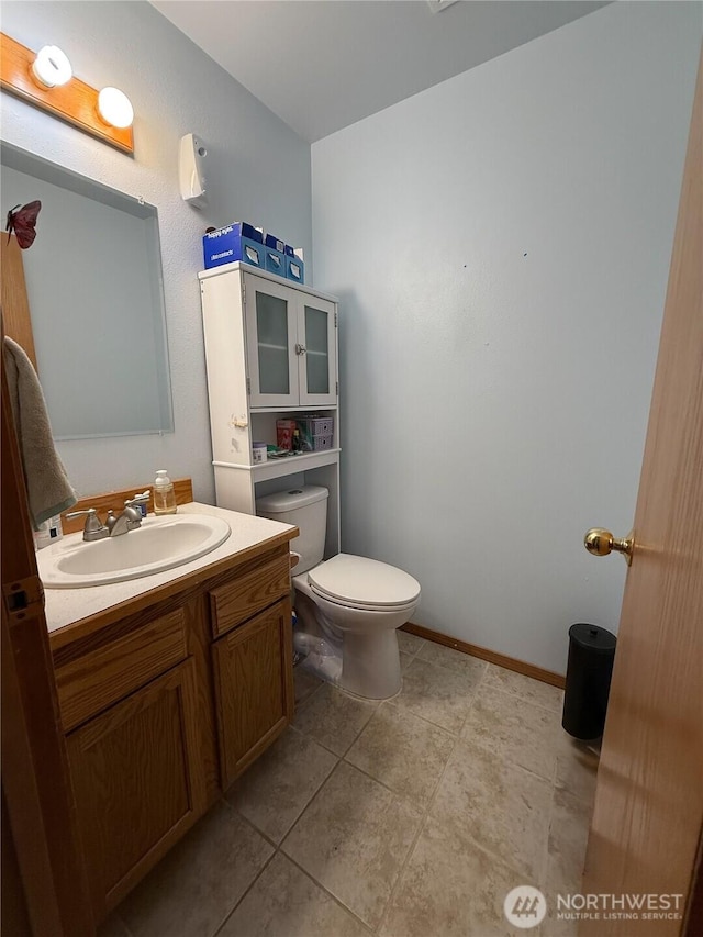 16 River Overlook St, Omak, WA 98841 - half bath featuring vanity and tile patterned floors
