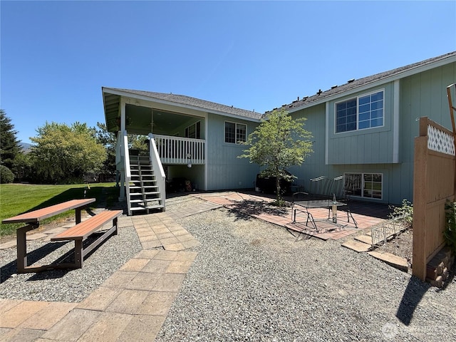 16 River Overlook St, Omak, WA 98841 - back of house with stairway and a patio area
