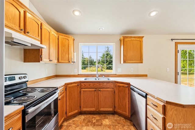 5436 180th Ave SW, Rochester, WA 98579 - kitchen featuring appliances with stainless steel finishes, under cabinet range hood, a peninsula, light countertops, and recessed lighting
