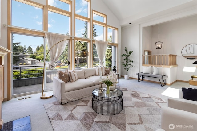 10135 NE 64th St Unit A, Kirkland, WA 98033 - carpeted living area with high vaulted ceiling and baseboards