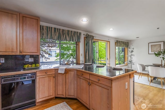 10135 NE 64th St Unit A, Kirkland, WA 98033 - kitchen featuring black dishwasher, light wood-type flooring, a peninsula, recessed lighting, and backsplash