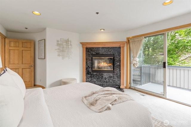 10135 NE 64th St Unit A, Kirkland, WA 98033 - bedroom with access to outside, carpet floors, recessed lighting, and a fireplace