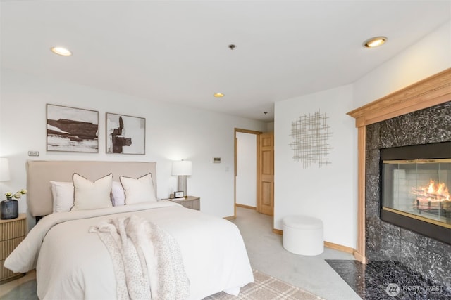 10135 NE 64th St Unit A, Kirkland, WA 98033 - carpeted bedroom with a tile fireplace and recessed lighting