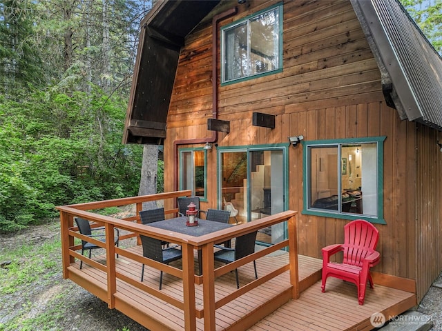 18690 Rieche Rd, Lake Wenatchee, WA 98826 - wooden terrace with outdoor dining area