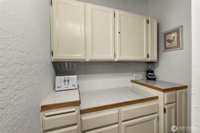 18690 Rieche Rd, Lake Wenatchee, WA 98826 - kitchen featuring tile counters and a textured wall