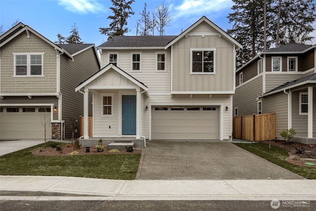 20424 E 97th Ave E Unit 6, Graham, WA 98338 - view of front of house with board and batten siding, an attached garage, and concrete driveway