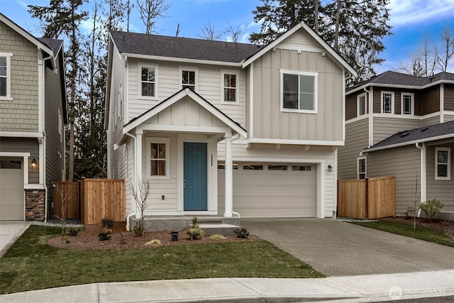 20424 E 97th Ave E Unit 6, Graham, WA 98338 - view of front of property featuring board and batten siding, concrete driveway, and a garage
