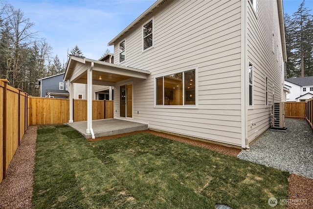 20424 E 97th Ave E Unit 6, Graham, WA 98338 - rear view of house with a patio and a fenced backyard