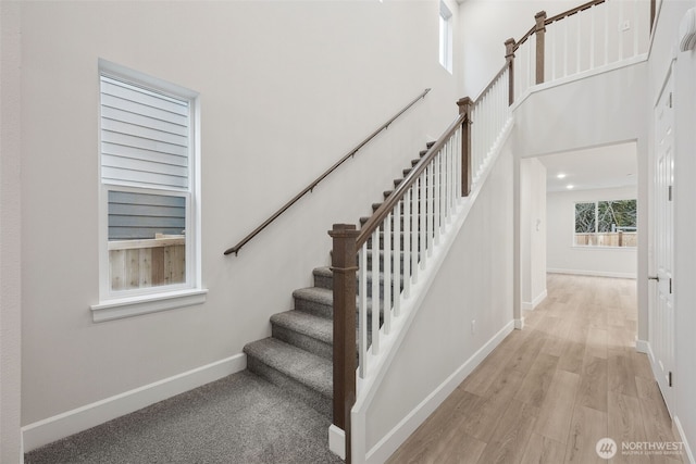 20424 E 97th Ave E Unit 6, Graham, WA 98338 - stairway featuring wood finished floors and a high ceiling